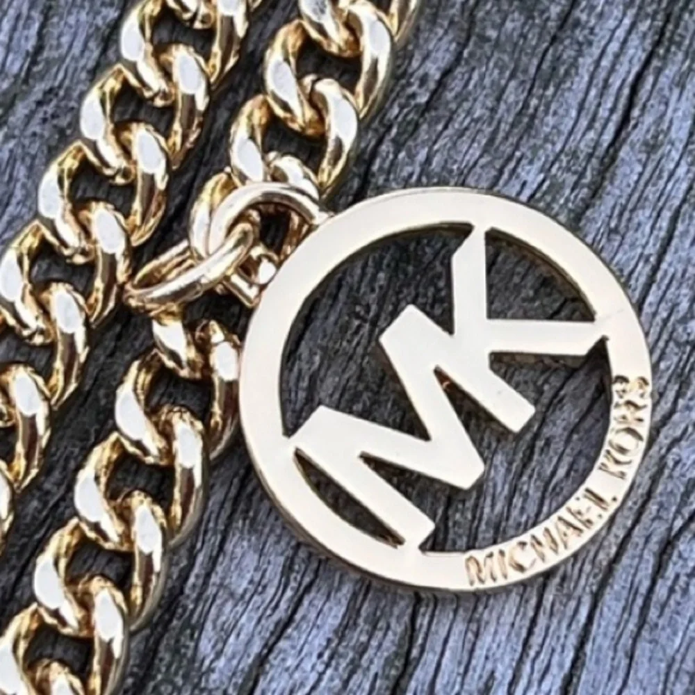 Michael Kors large tassel on chain